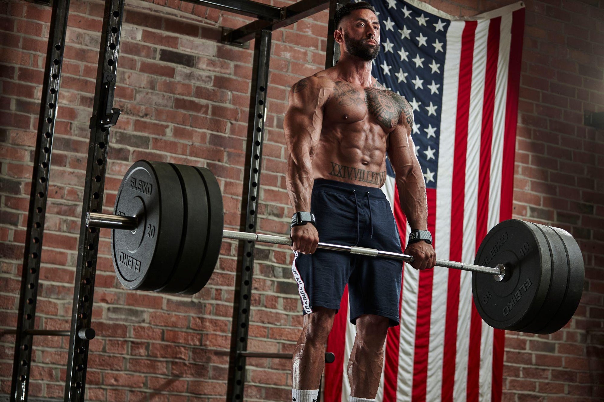 Male powerlifter using Versa Gripps in the gym